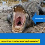 Alligator biting the competition