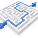 A blue arrow points to a maze on a white background, guiding the way through the intricate paths