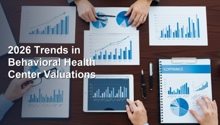 Four people work at a table covered with charts, graphs, and a tablet; text reads "2026 Trends in Behavioral Health Center Valuations.